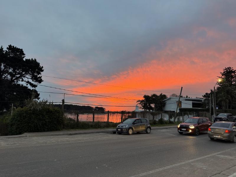 Sunset in the background of a street with traffic