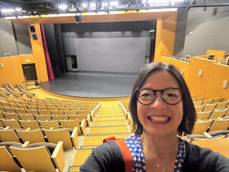 Selfie in the empty Crofton House auditorium with the stage behind
